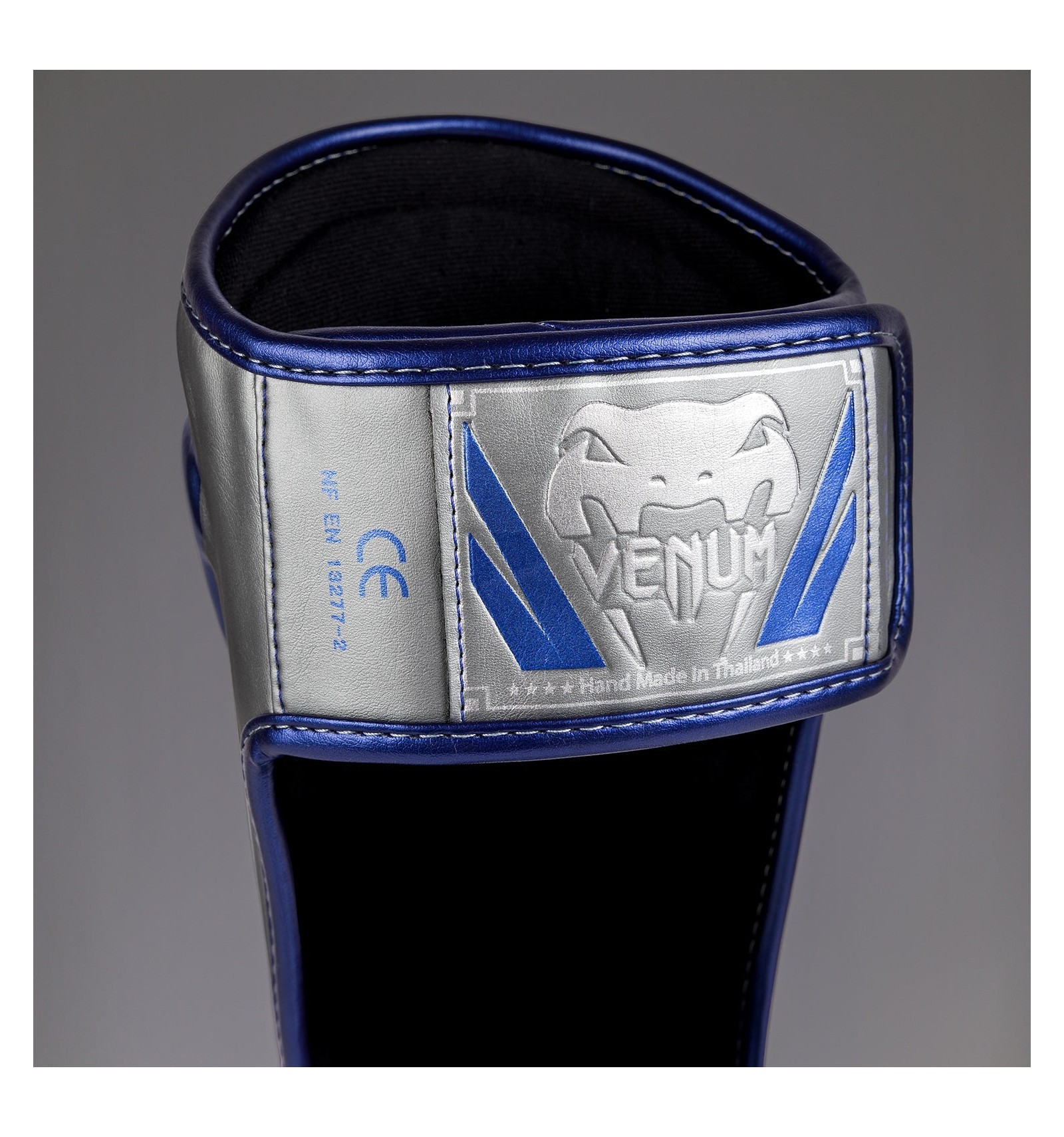 venum canillera elite plata/azul