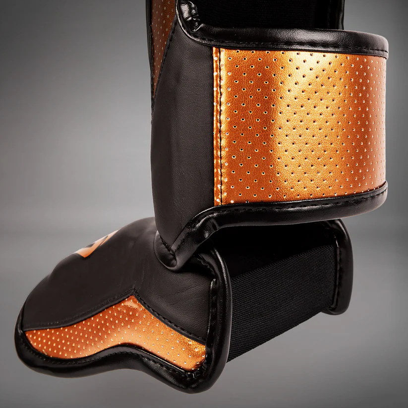 venum canillera elite evo bronce